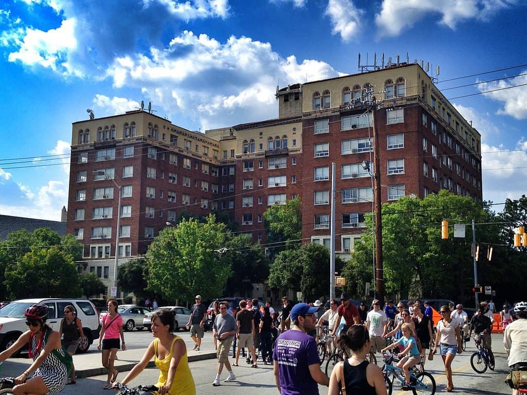 people walking past the Briarcliff Hotel in Atlanta, Georgia