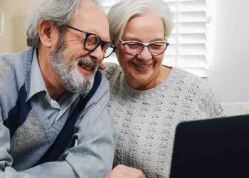 Mature couple looking at laptop