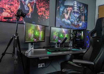 Game Room with large screens and computer desk with gaming chair