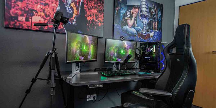 Game Room with large screens and computer desk with gaming chair