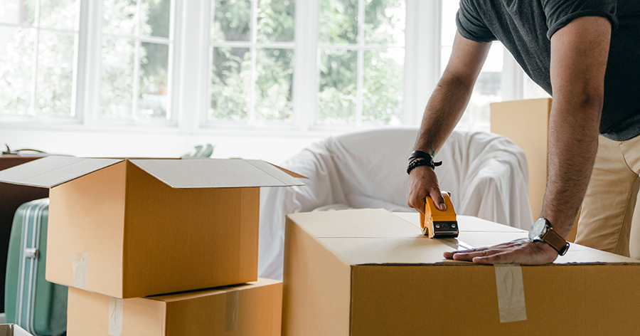 Man taping boxes