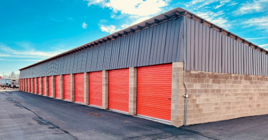 Row of red outdoor storage units.