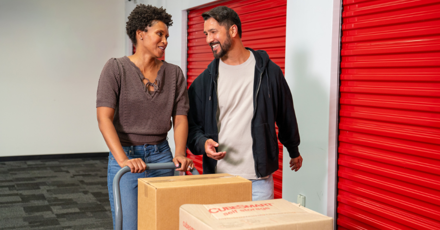 Couple moving into a storage unit.