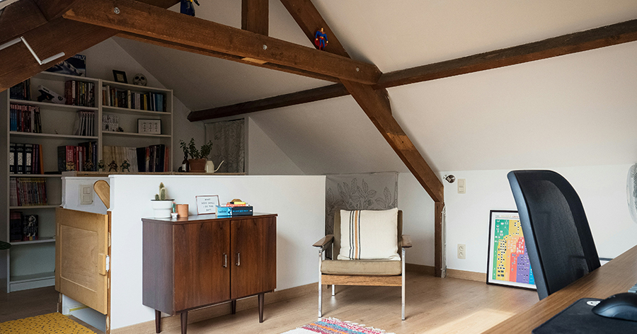 Organized, finished attic with high ceilings and an office.