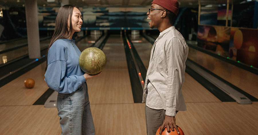 Man and woman bowling