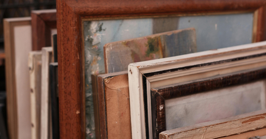 Different pictures and paintings stacked together