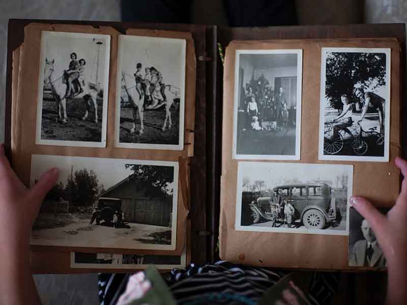Open photo album with antique photos