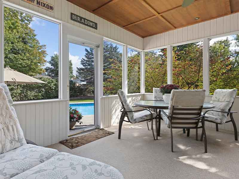 Sunroom with glass doors and windows