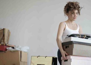 Woman carrying boxes