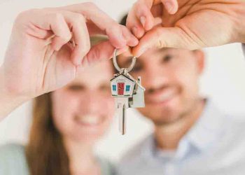 Couple holding house keys
