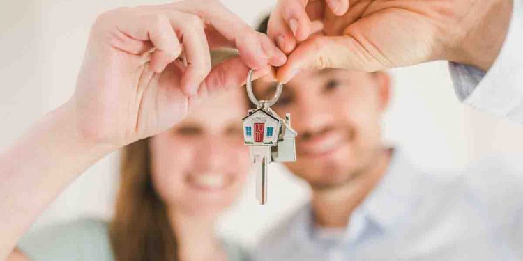Couple holding house keys