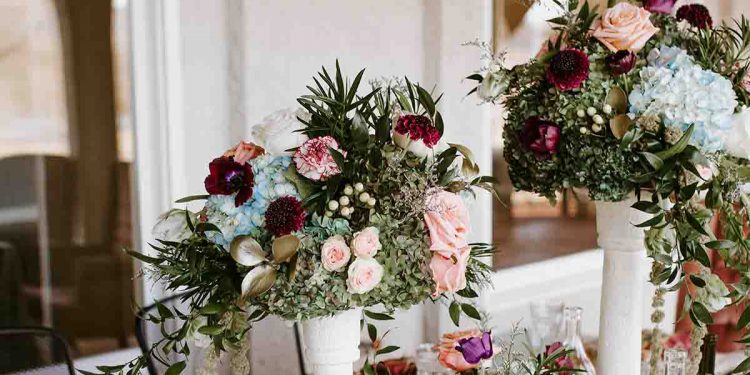 Floral arrangement and food on table
