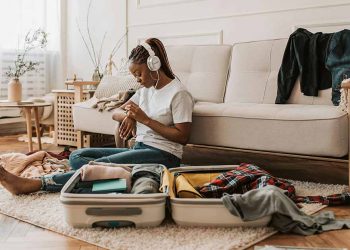 Woman packing suitcase