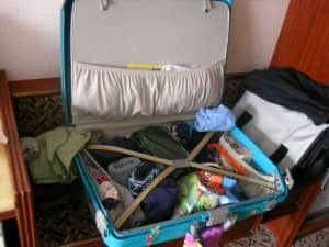open suitcase with clothes and essentials