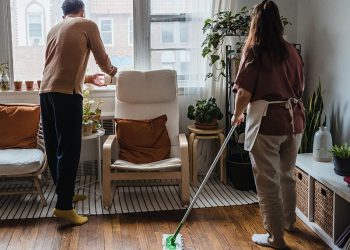 Couple cleaning their apartment