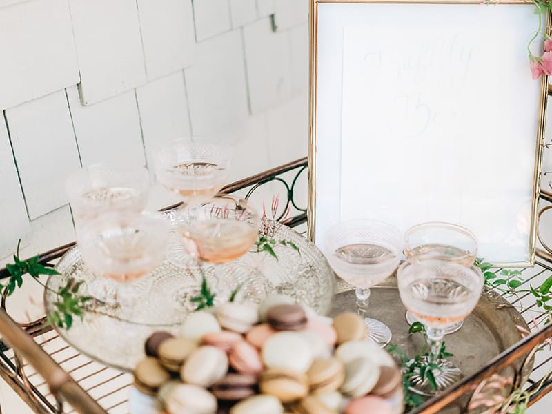 Bar cart with macrons and cocktails