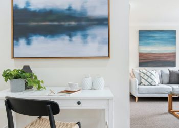 Blue canvas painting hanging in living room