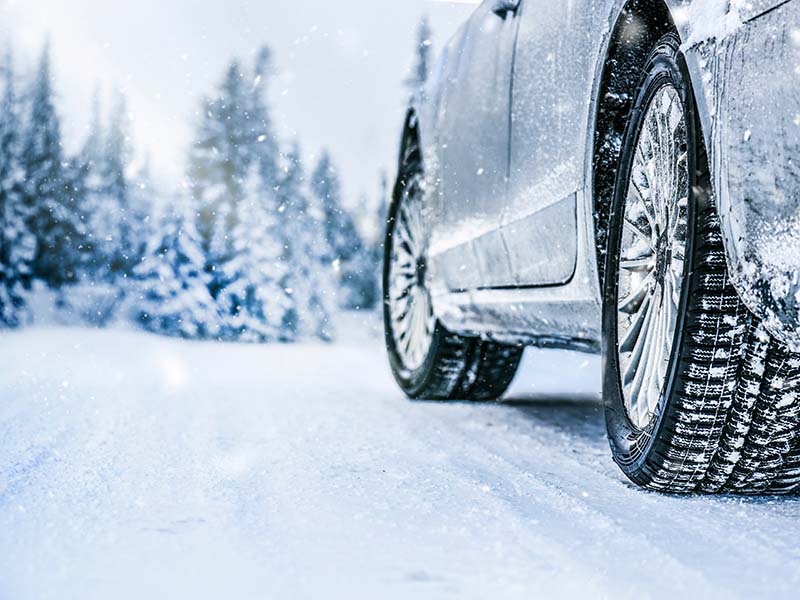Car and tires in snow