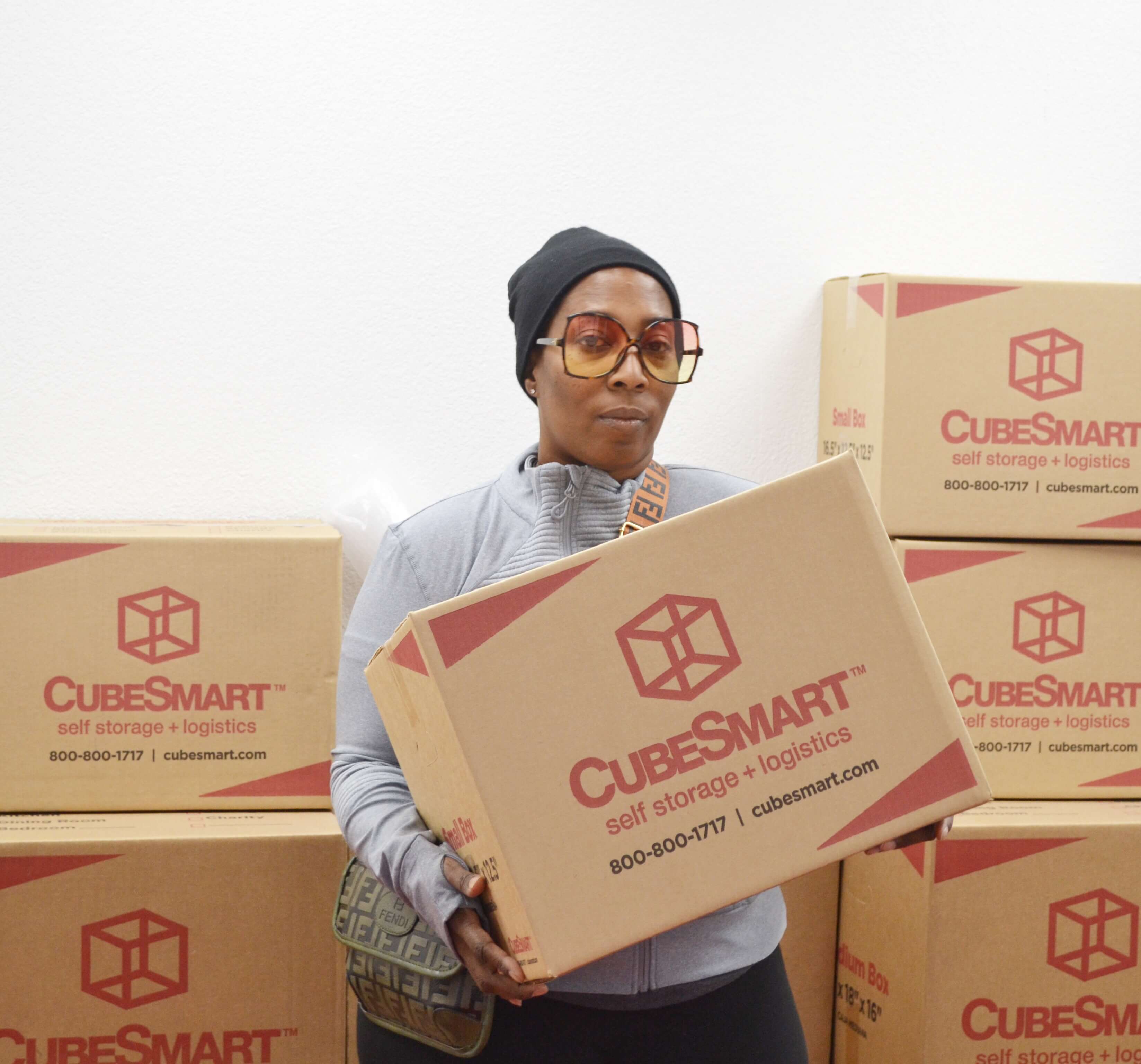 Traci M. holding CubeSmart boxes