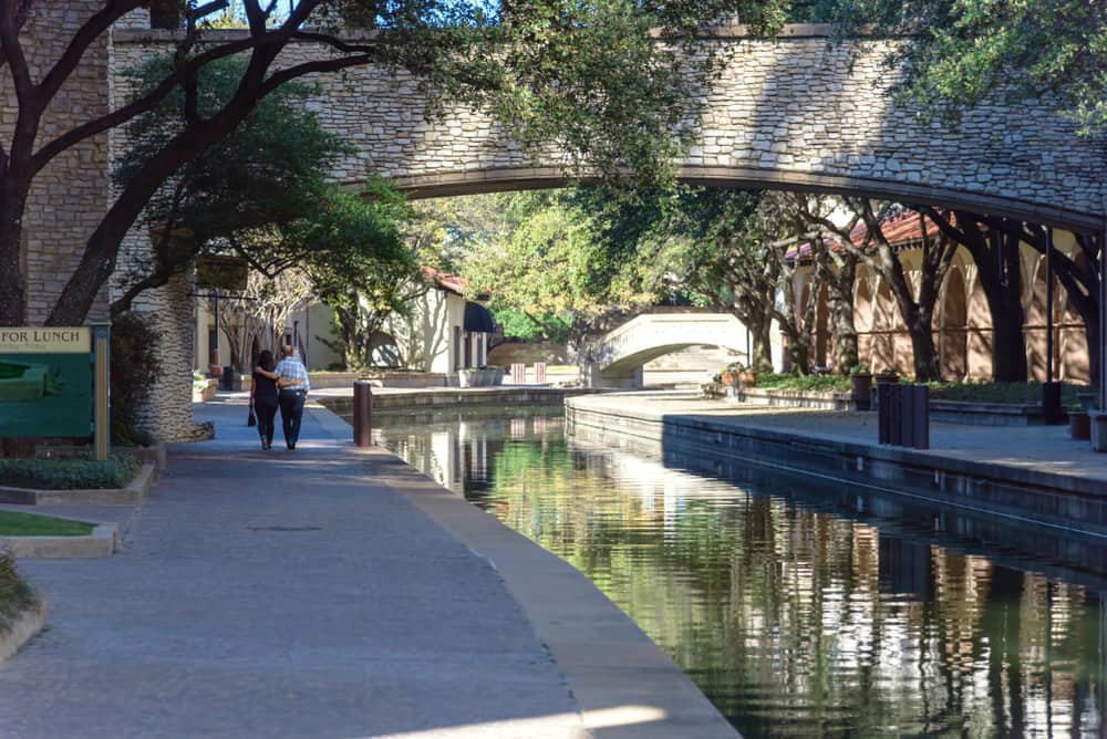couple walking along Mandalay Canals in Irving Texas