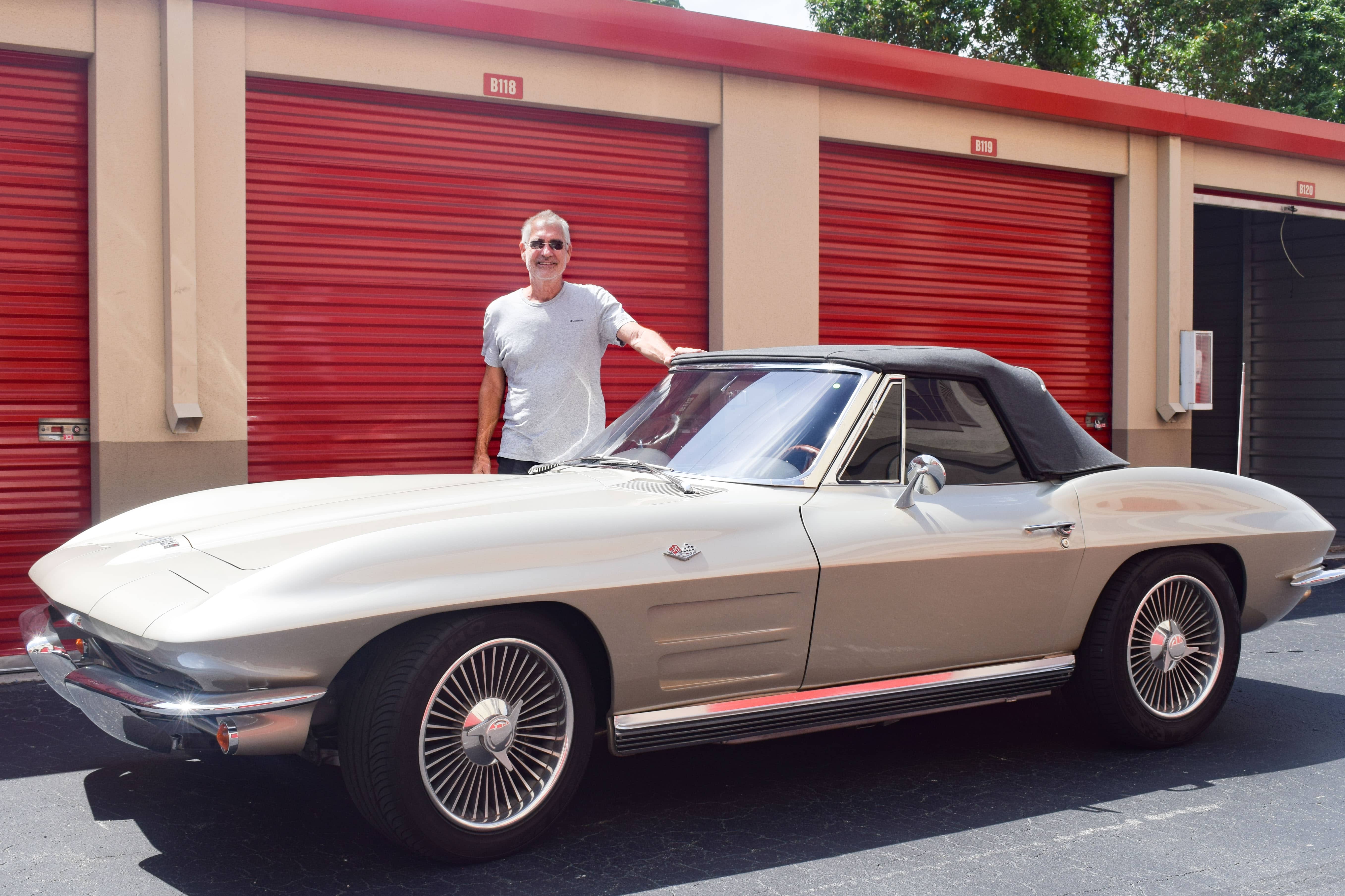 Scott Sheridan standing next to his 1964 Corvette