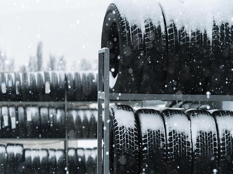 tires on rack snowing