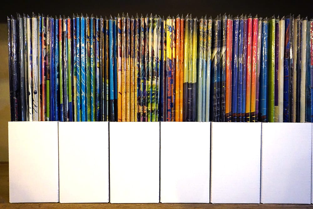 comic book spines in cardboard boxes