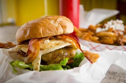 burger topped with bacon, cheese, and egg from Edzo's in Chicago
