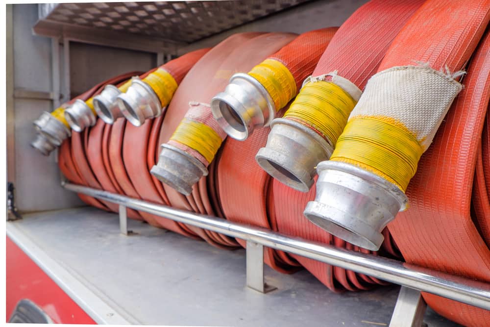 Rolled orange fire hoses