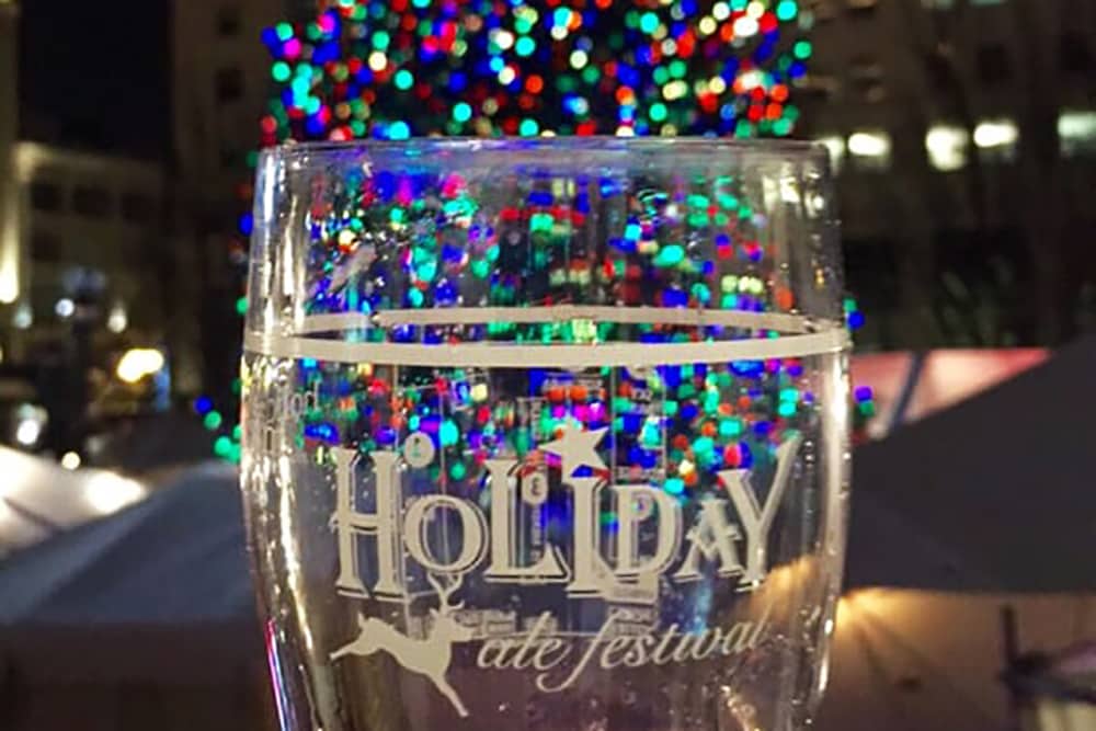 pint glass in front of christmas tree at holiday ale fest