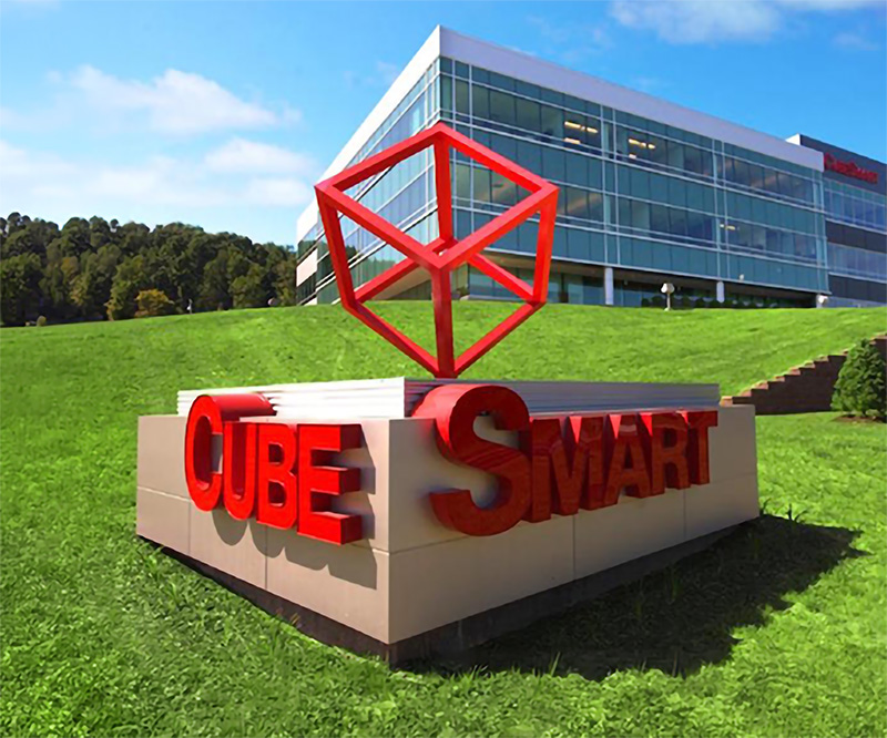 CubeSmart logo sign outside a corporate office building.
